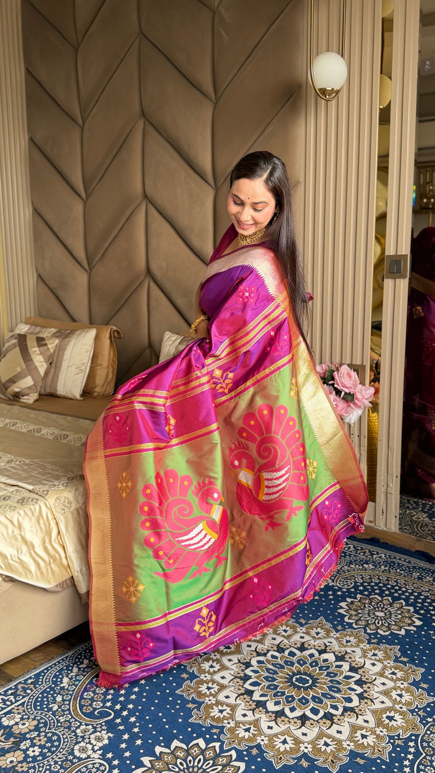 Magenta soft silk ikkat patola saree with meenakari motifs peacock pallu and gold zari border