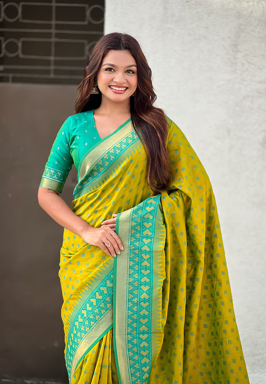 Mehendi green soft silk zari woven patola saree with contrast bandhani weaves
