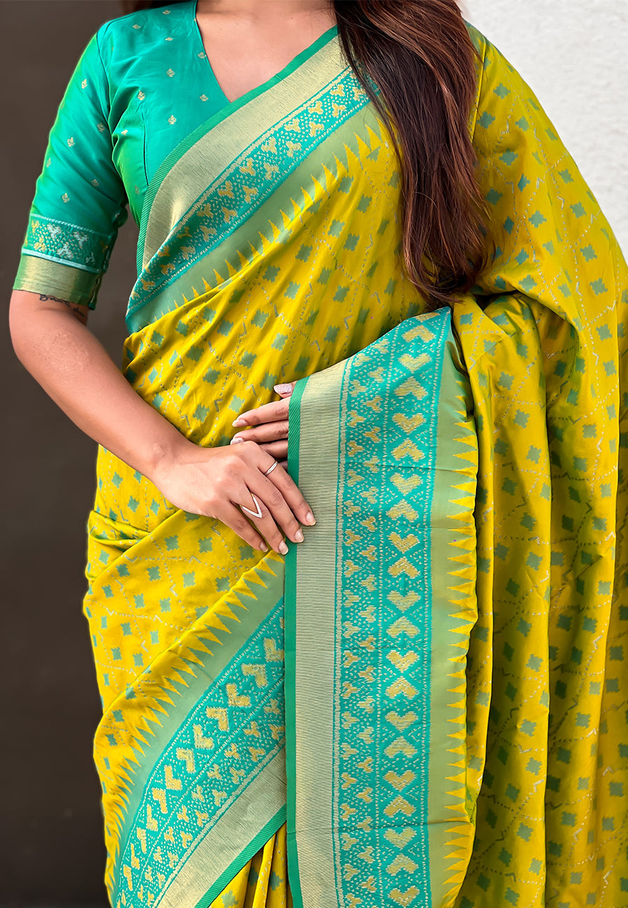 Mehendi green soft silk zari woven patola saree with contrast bandhani weaves
