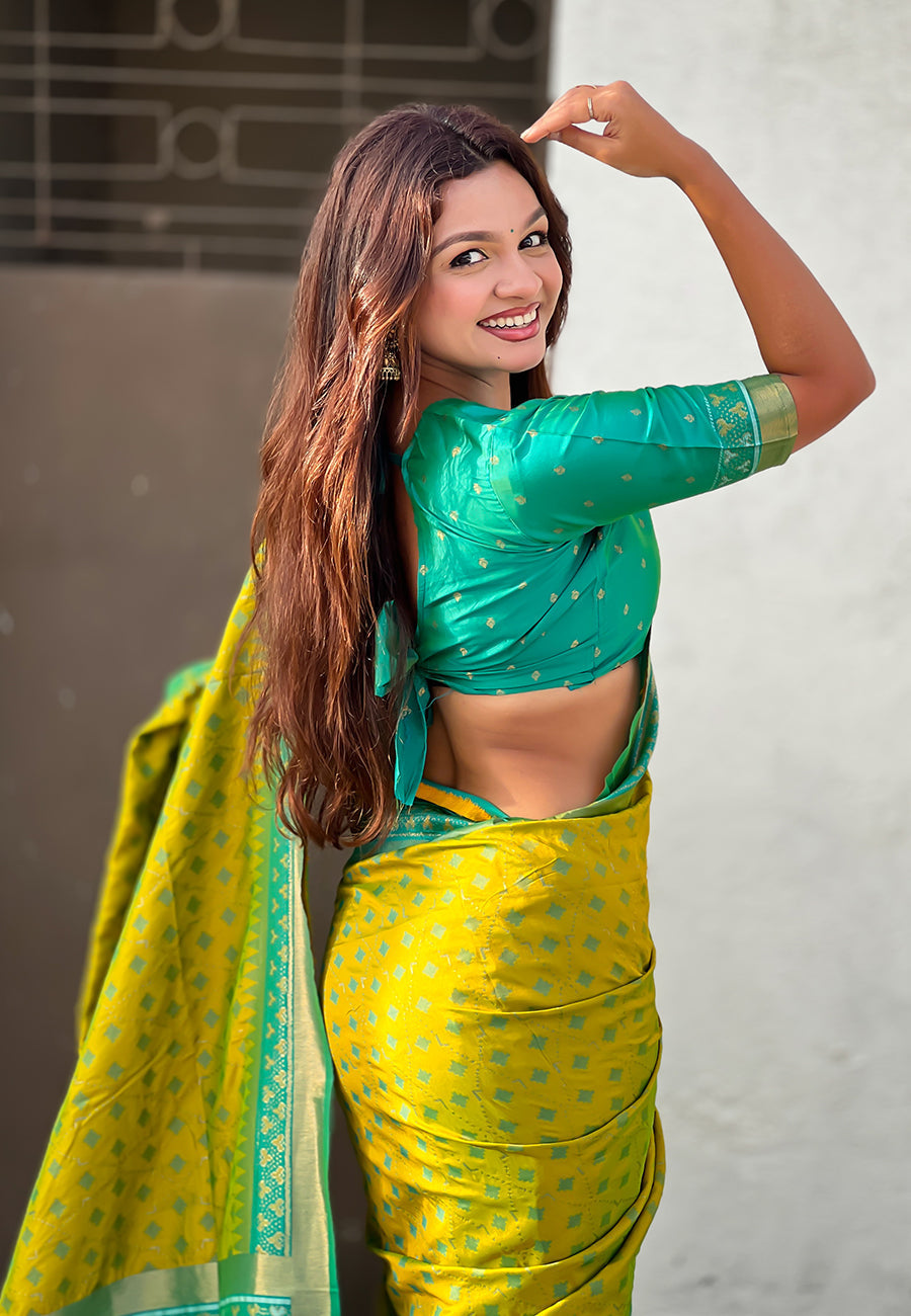 Mehendi green soft silk zari woven patola saree with contrast bandhani weaves