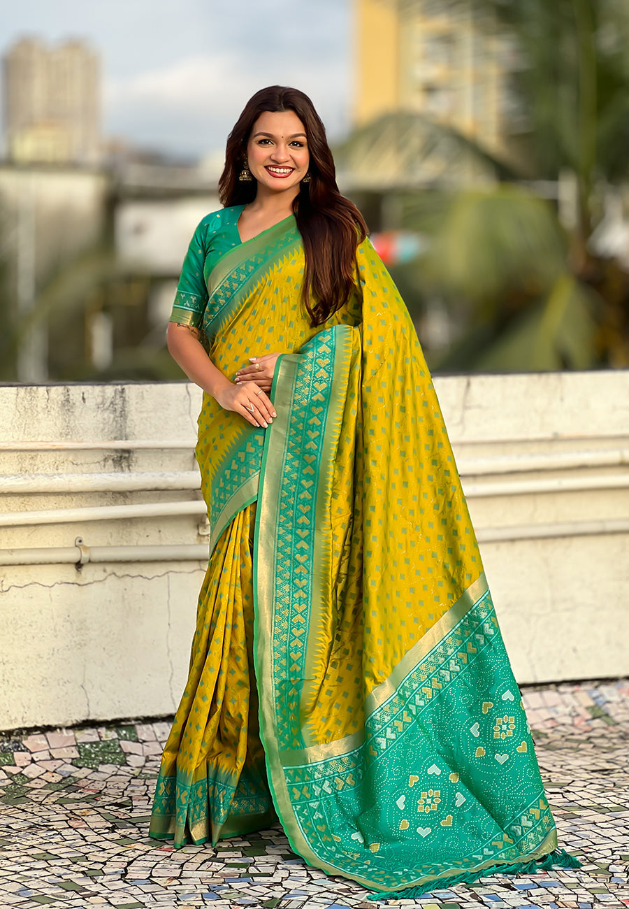 Mehendi green soft silk zari woven patola saree with contrast bandhani weaves