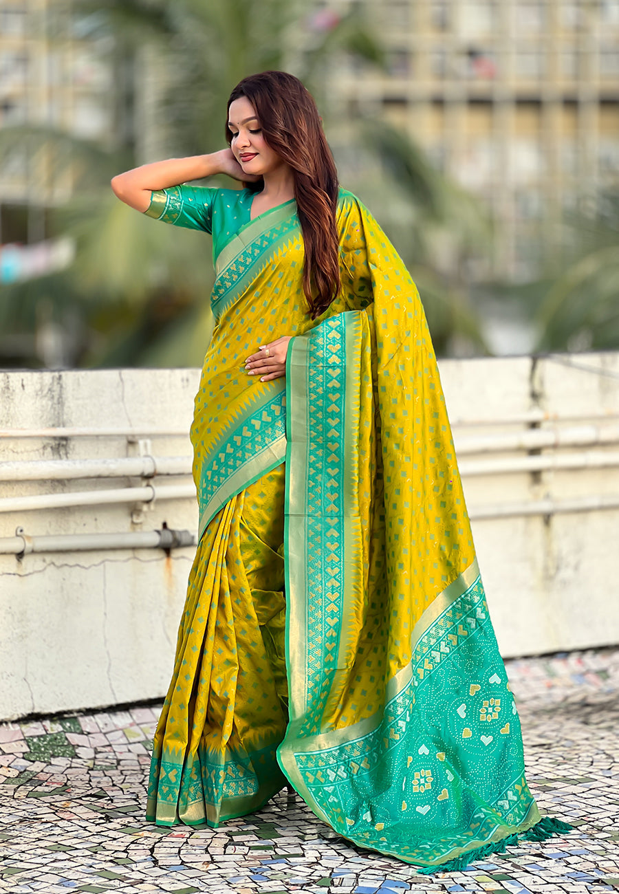 Mehendi green soft silk zari woven patola saree with contrast bandhani weaves