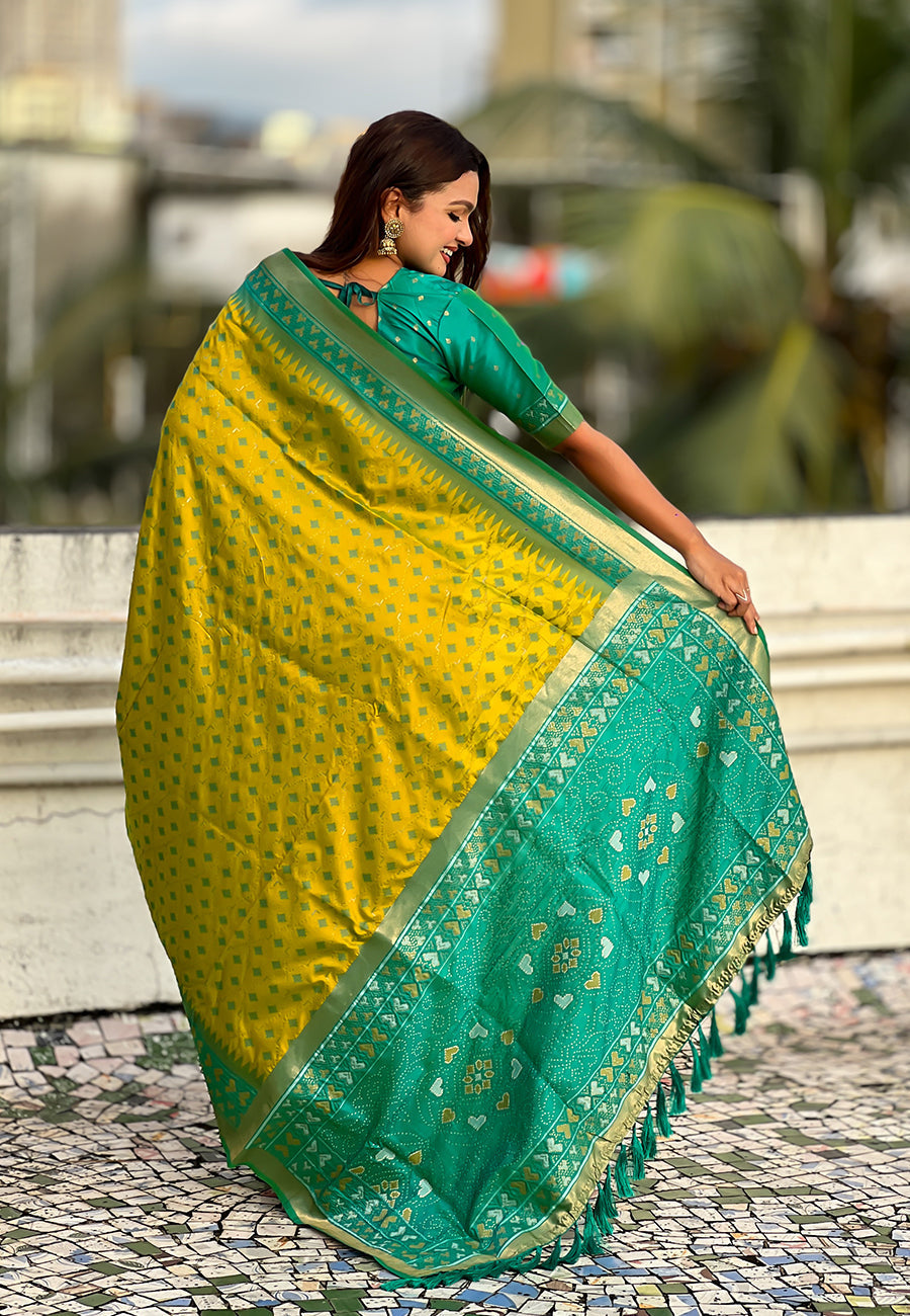 Mehendi green soft silk zari woven patola saree with contrast bandhani weaves