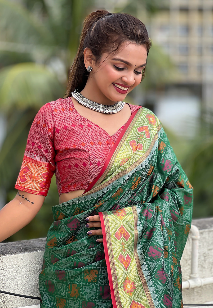 Green soft patola silk meenakari zari woven saree