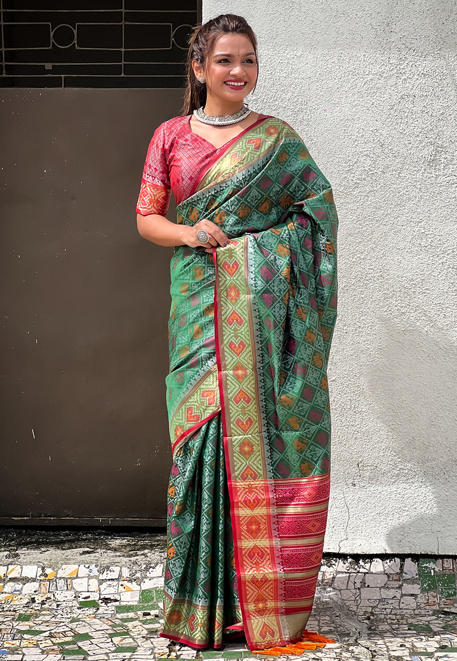 Green soft patola silk meenakari zari woven saree