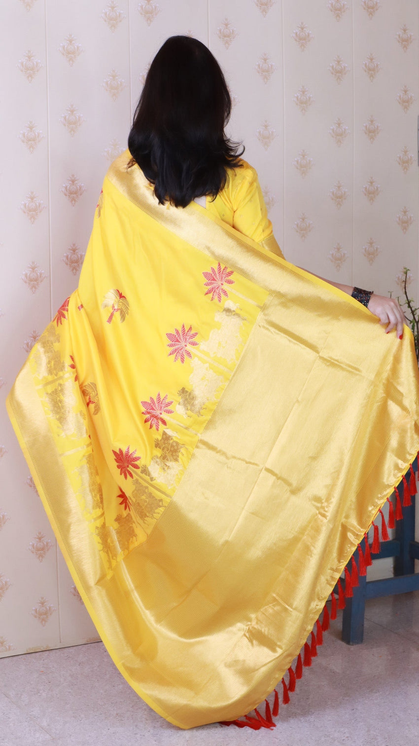 Bright yellow soft silk saree with kamdhenu weaves zari woven saree