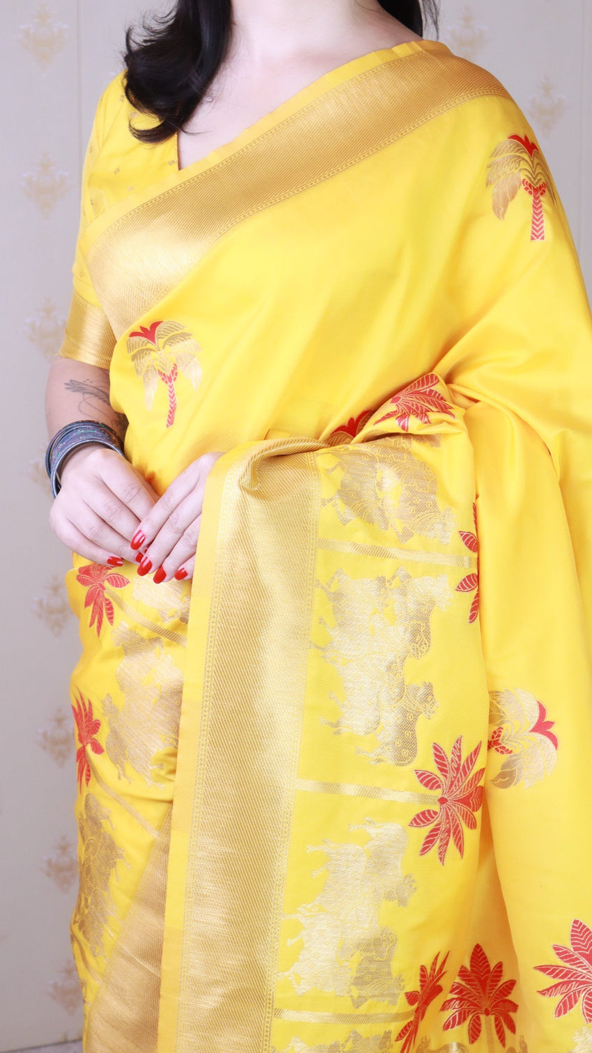 Bright yellow soft silk saree with kamdhenu weaves zari woven saree