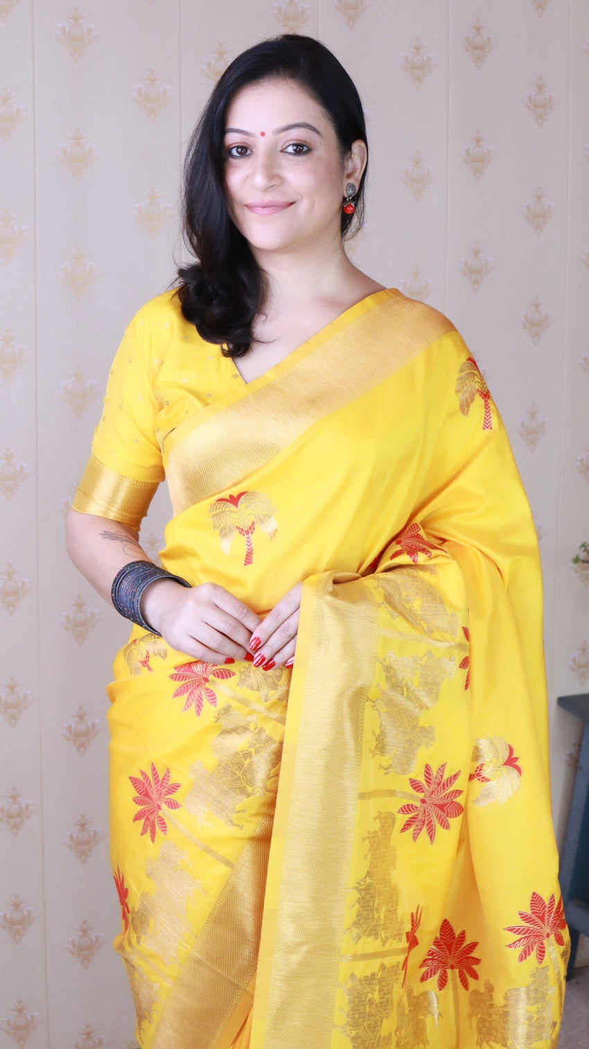Bright yellow soft silk saree with kamdhenu weaves zari woven saree