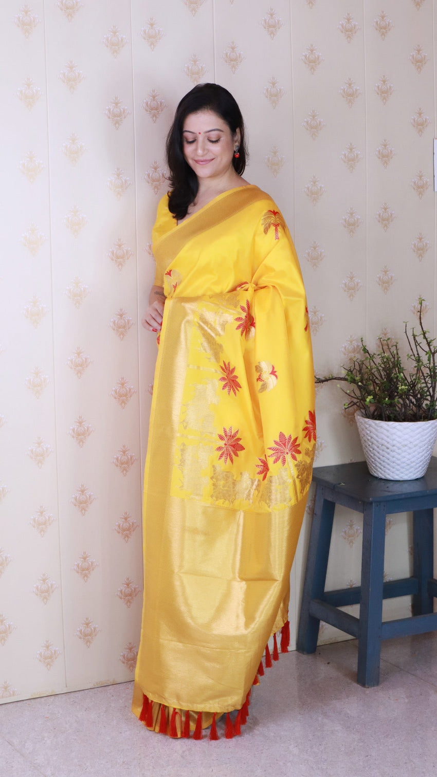 Bright yellow soft silk saree with kamdhenu weaves zari woven saree