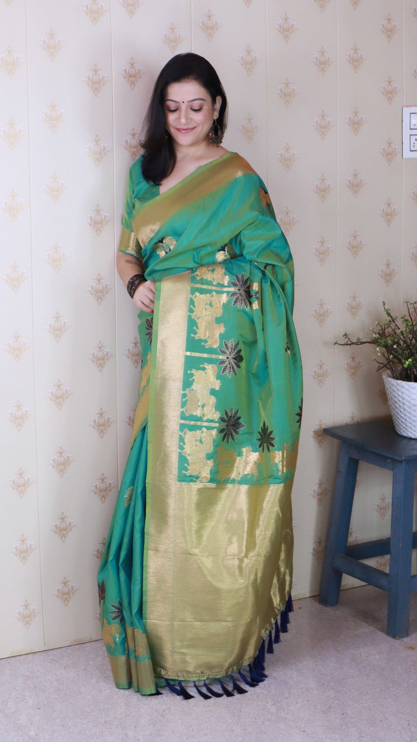 Green soft silk saree with kamdhenu weaves zari woven saree