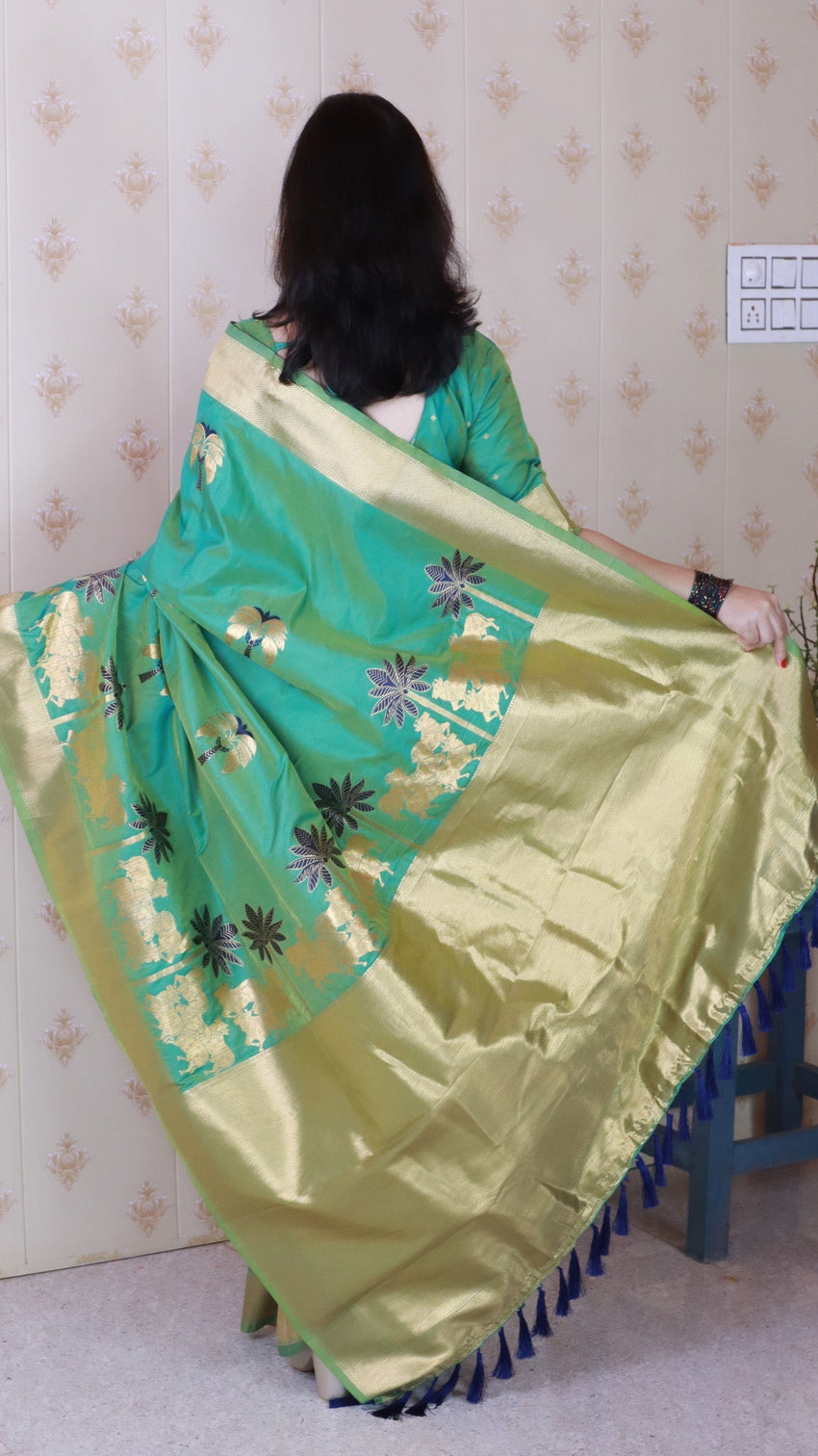 Green soft silk saree with kamdhenu weaves zari woven saree