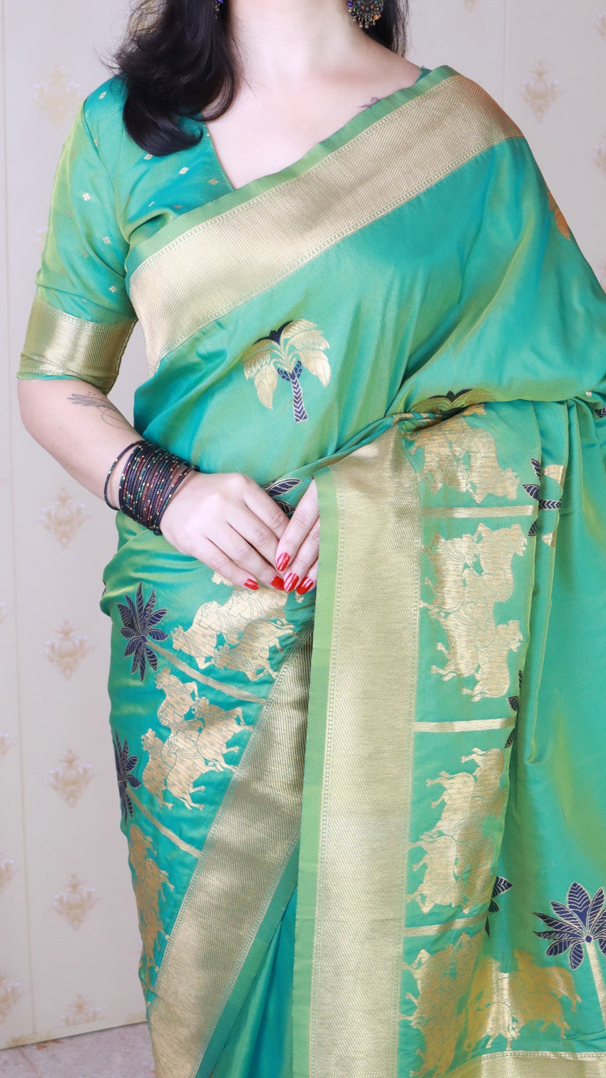 Green soft silk saree with kamdhenu weaves zari woven saree