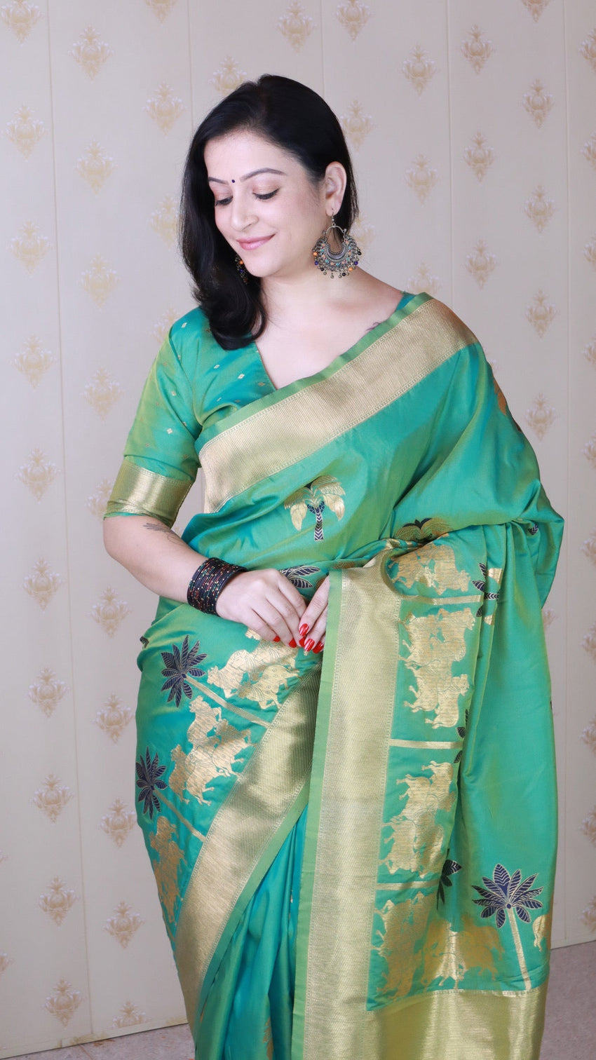 Green soft silk saree with kamdhenu weaves zari woven saree