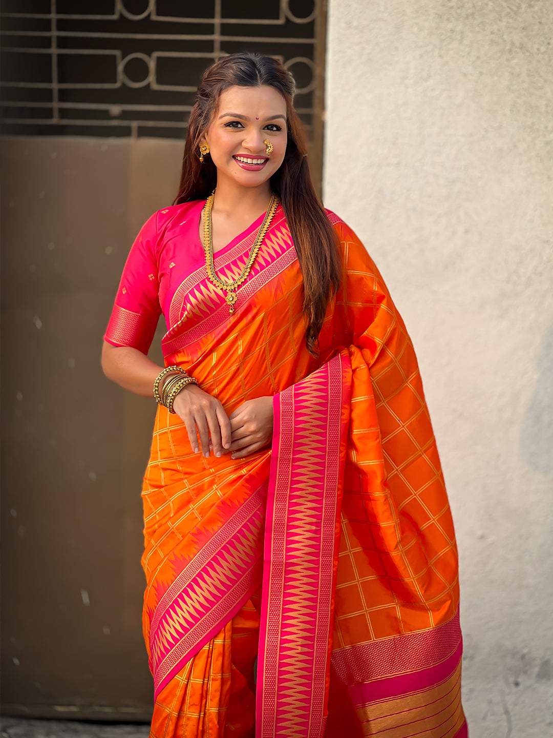 Orange soft silk checks traditional zari contrast woven saree