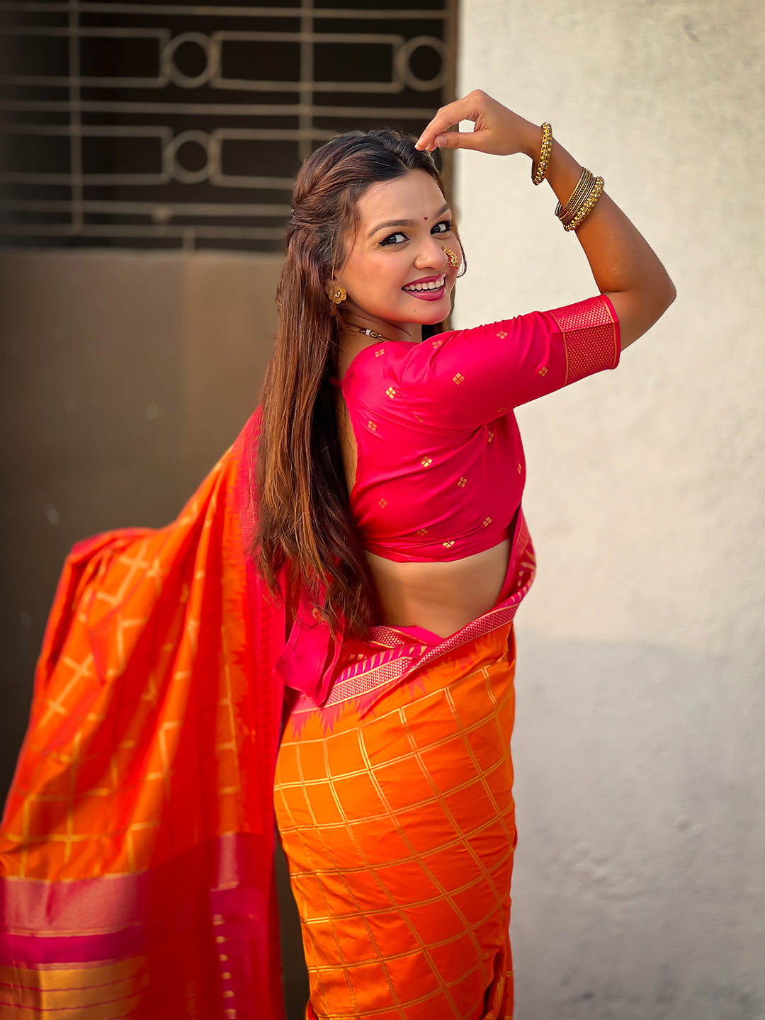 Orange soft silk checks traditional zari contrast woven saree
