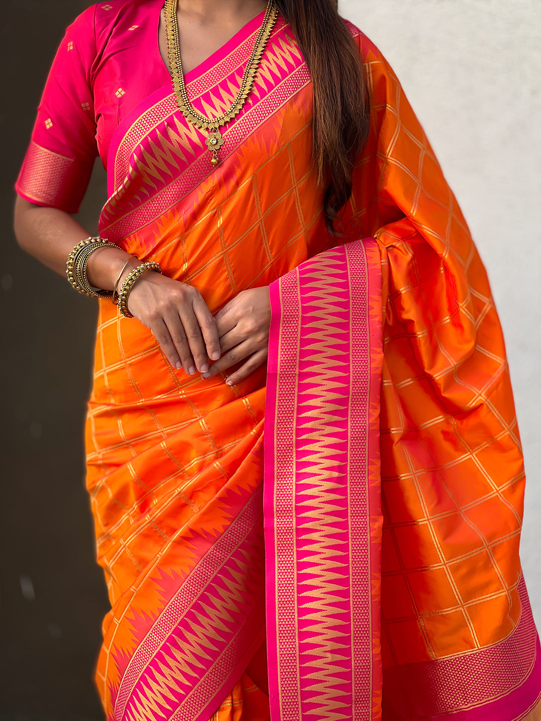 Orange soft silk checks traditional zari contrast woven saree