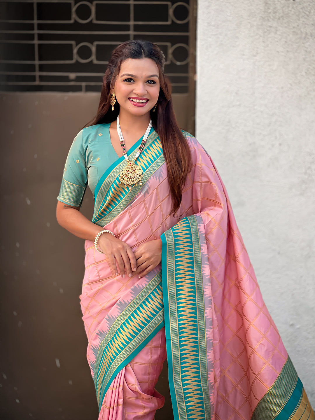 Baby pink soft silk checks traditional zari contrast woven saree