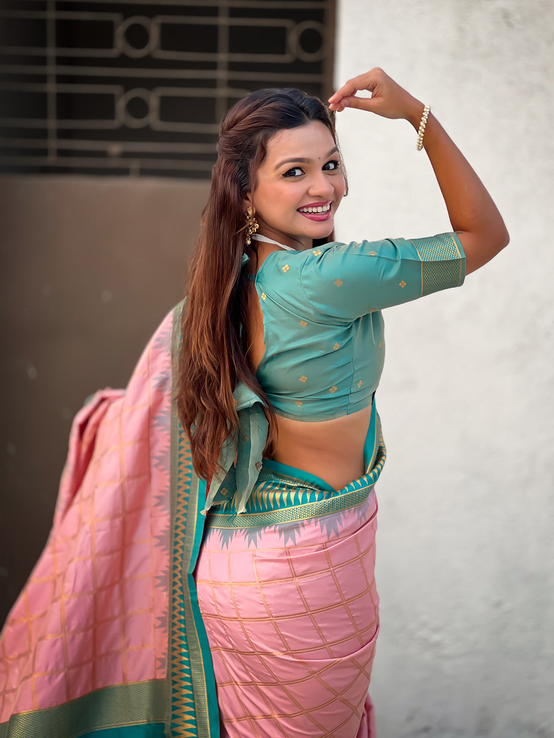 Baby pink soft silk checks traditional zari contrast woven saree