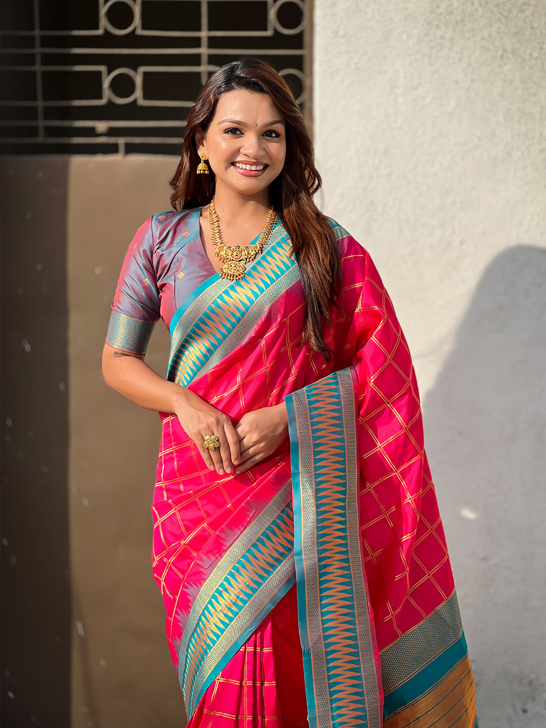 Pink soft silk checks traditional zari contrast woven saree