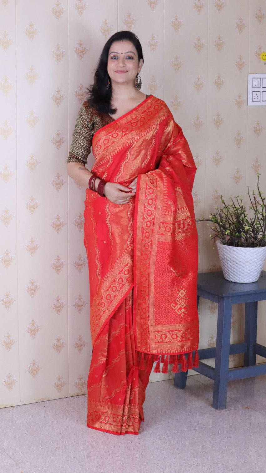 Pink soft silk bandhani leheriya zari woven saree