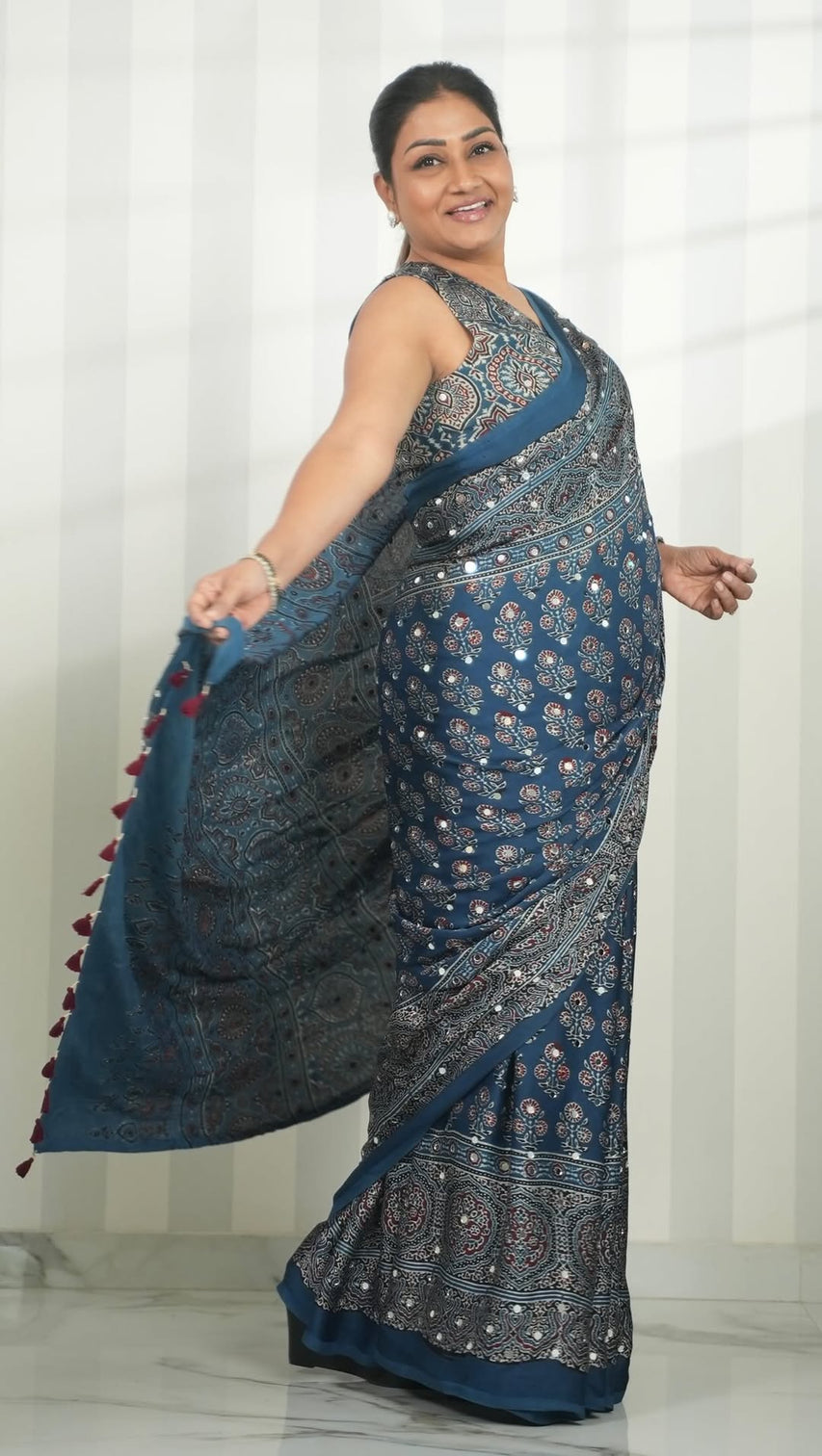 Steel blue modal silk ajrakh print saree with floral motifs designer pallu tassel border traditional ethnic wear saree mameraa