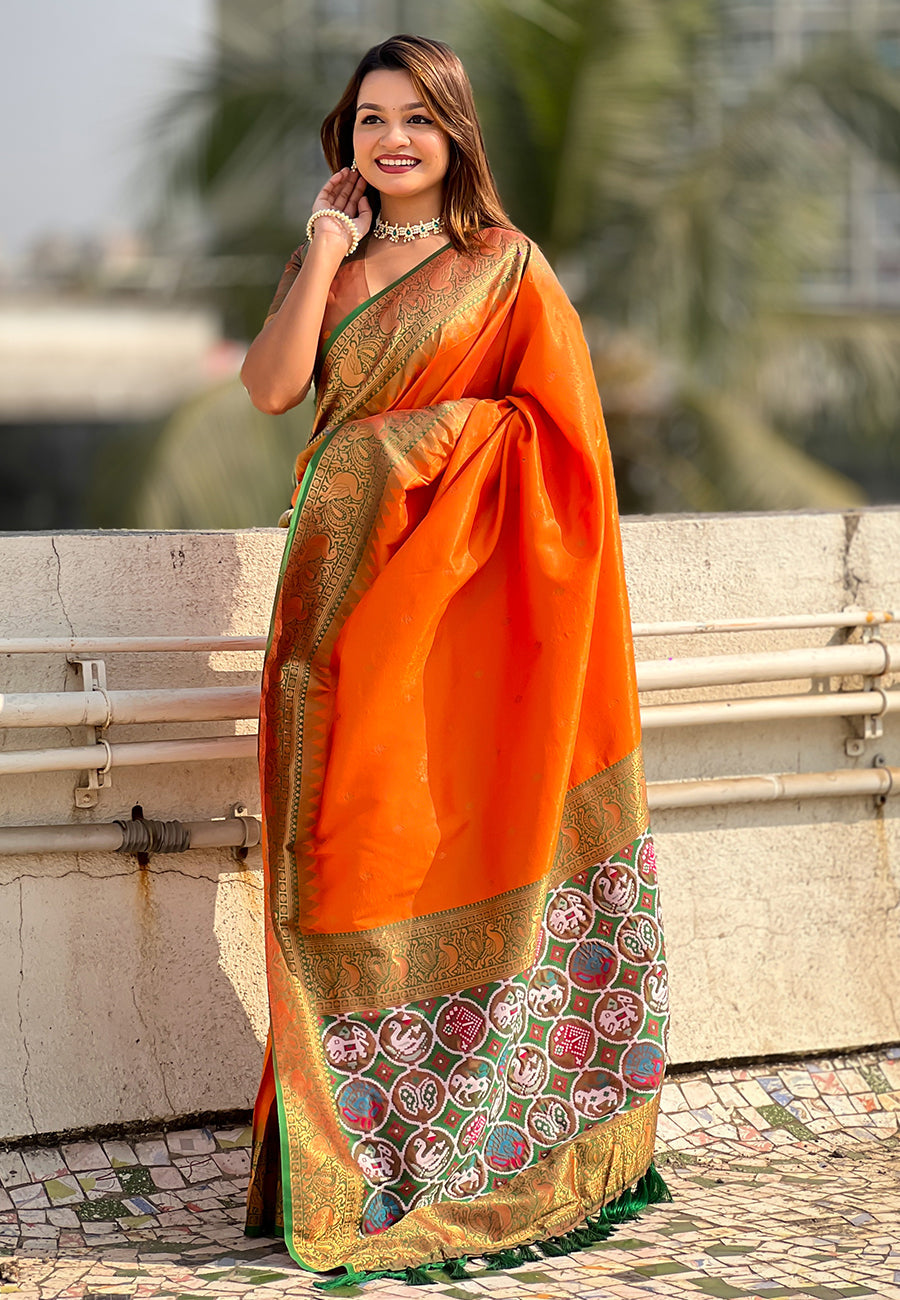 Orange pure tissue zari woven patola saree with contrast weaves