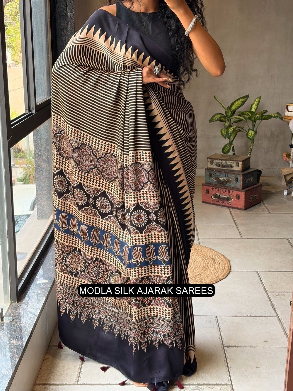 Black beige modal silk ajrakh printed saree with geometric stripes heritage pallu tassel detailing