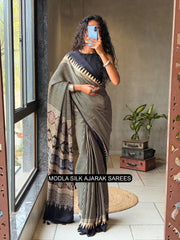 Black beige modal silk ajrakh printed saree with geometric stripes heritage pallu tassel detailing mameraa