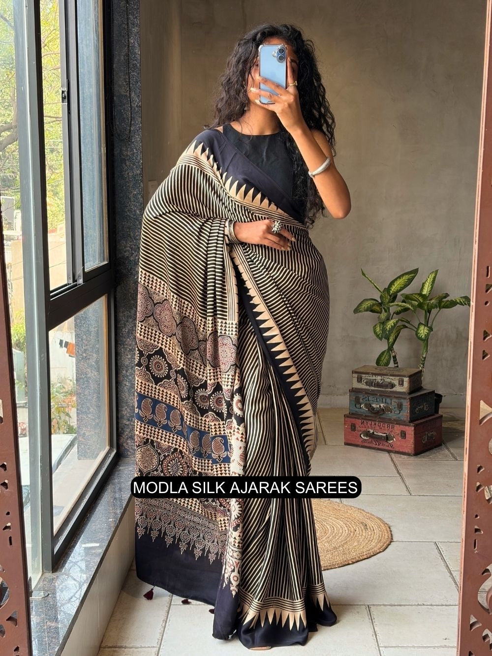 Black beige modal silk ajrakh printed saree with geometric stripes heritage pallu tassel detailing