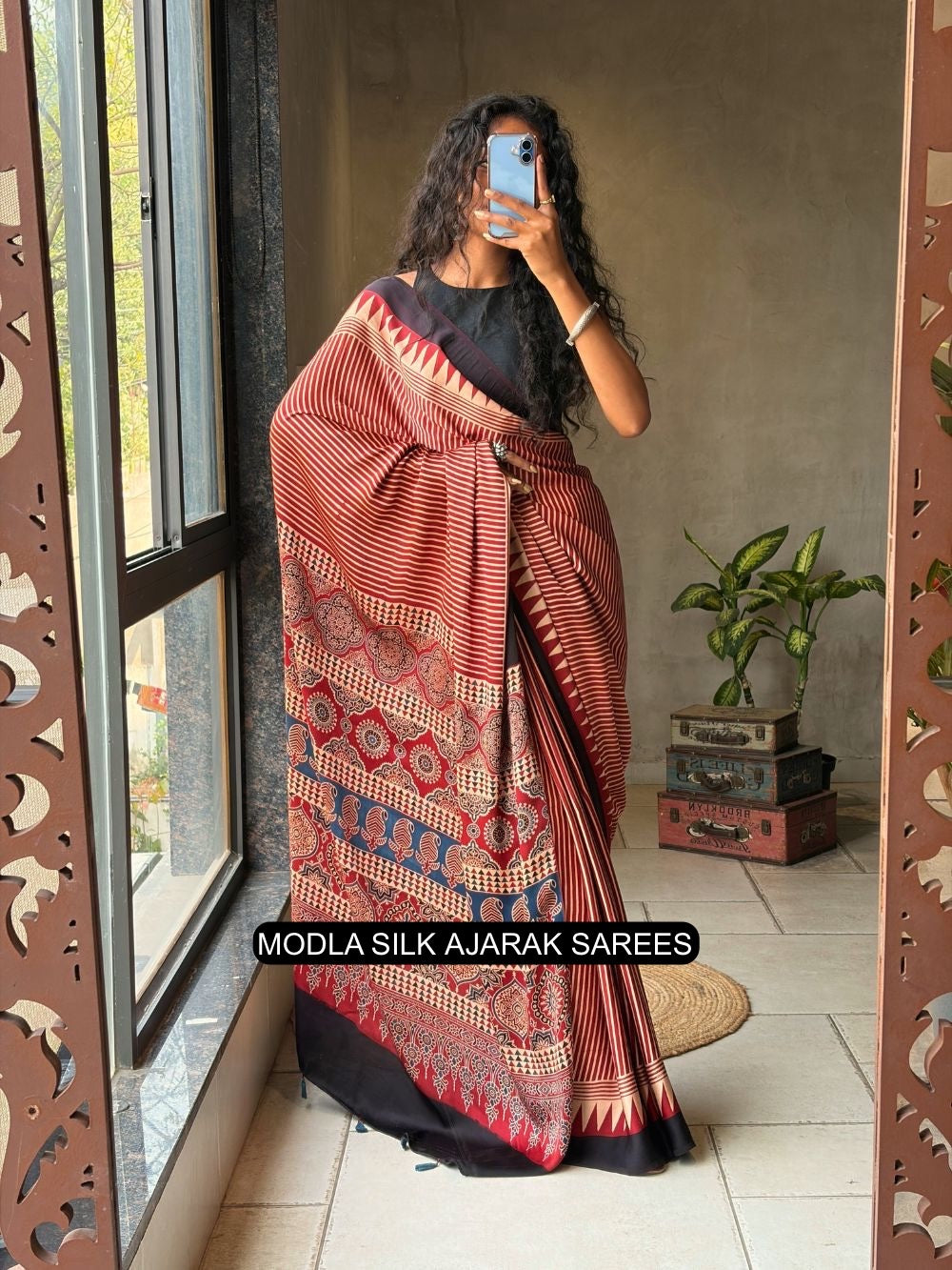 Red beige modal silk ajrakh printed saree with striped design heritage pallu tassel detailing