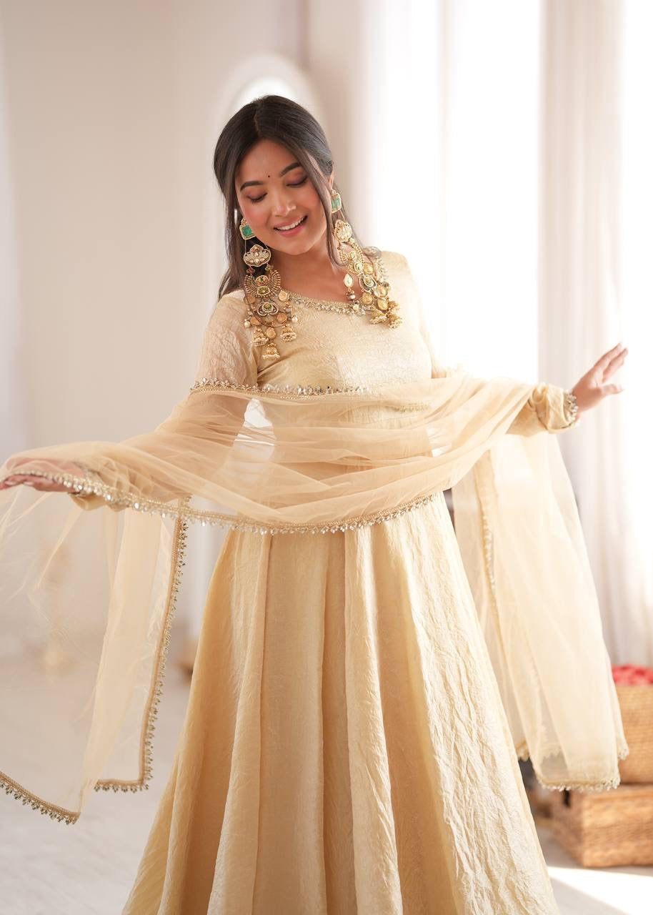 Elegant cream gold anarkali suit set with lace trimmed dupatta