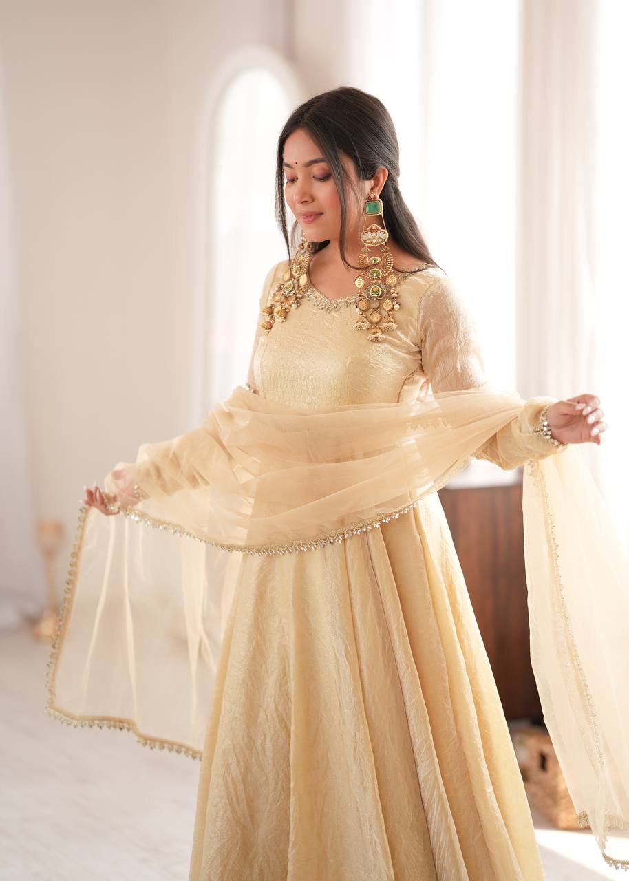 Elegant cream gold anarkali suit set with lace trimmed dupatta