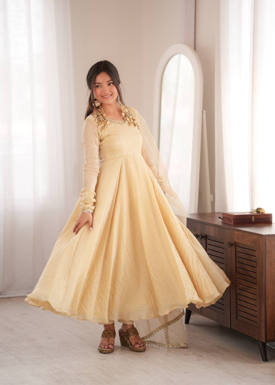 Elegant cream gold anarkali suit set with lace trimmed dupatta
