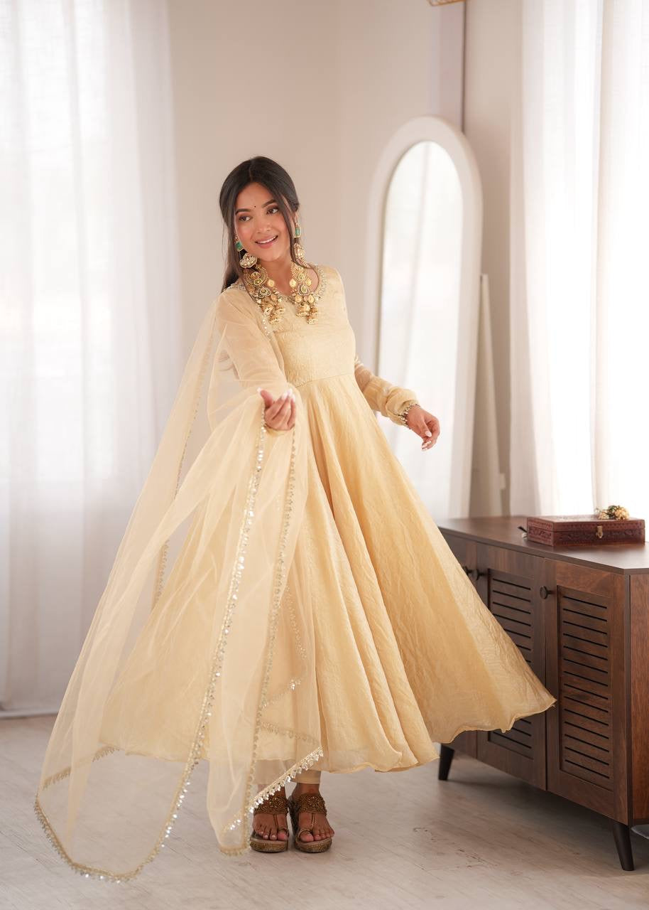 Elegant cream gold anarkali suit set with lace trimmed dupatta