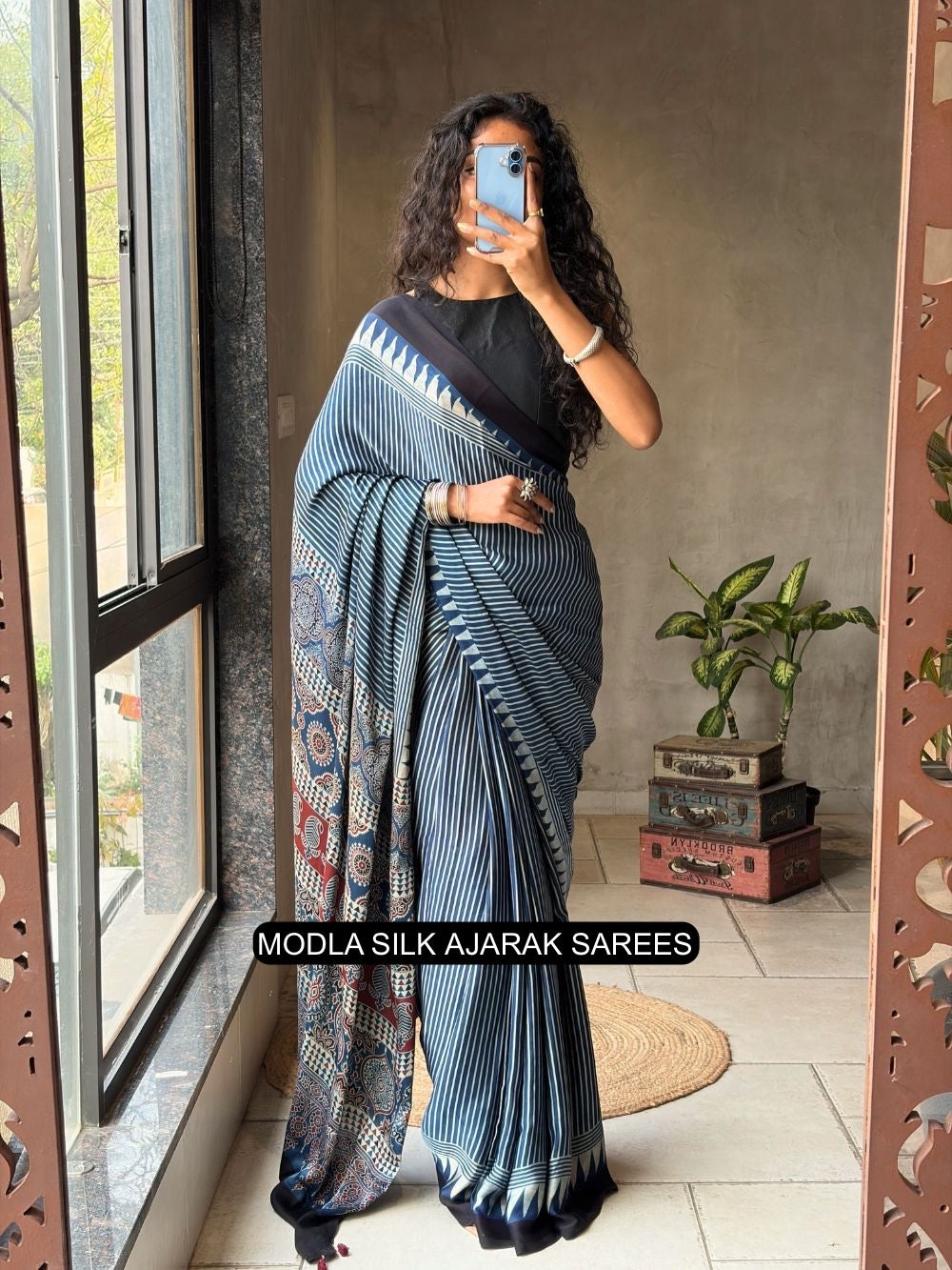 Steel blue modal silk ajrakh printed saree with striped design heritage pallu tassel detailing mameraa