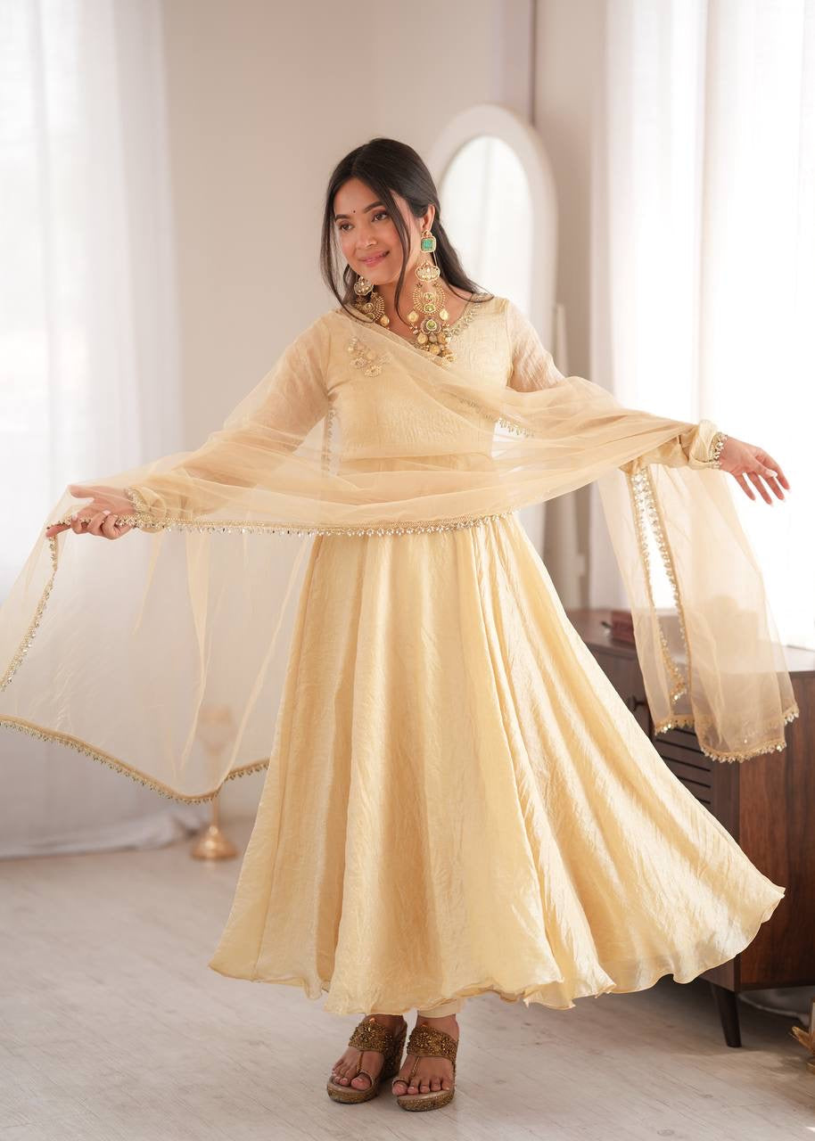 Elegant cream gold anarkali suit set with lace trimmed dupatta