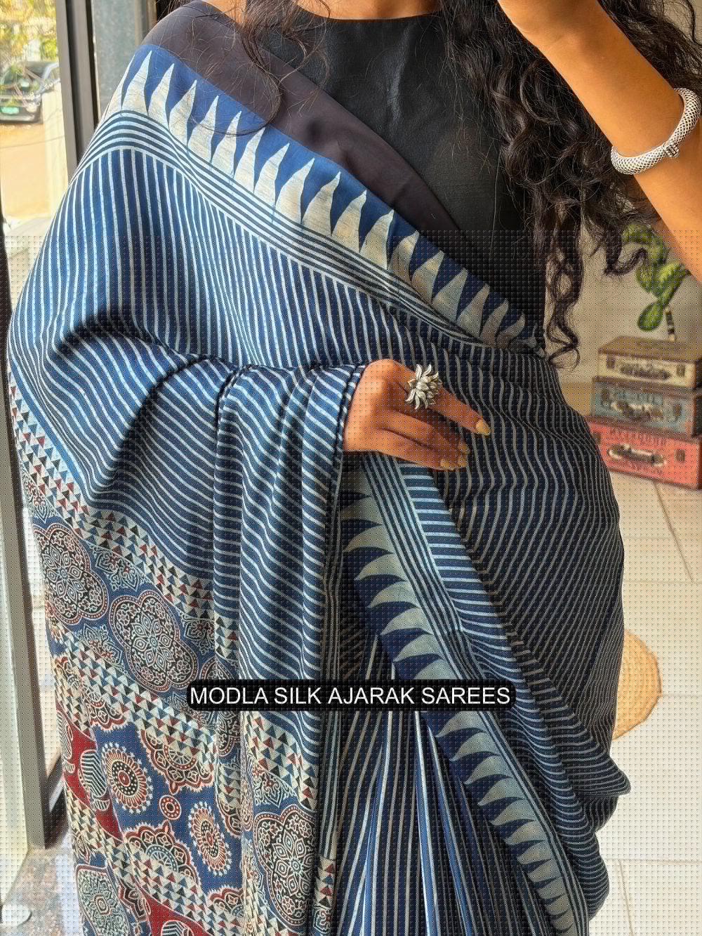 Steel blue modal silk ajrakh printed saree with striped design heritage pallu tassel detailing