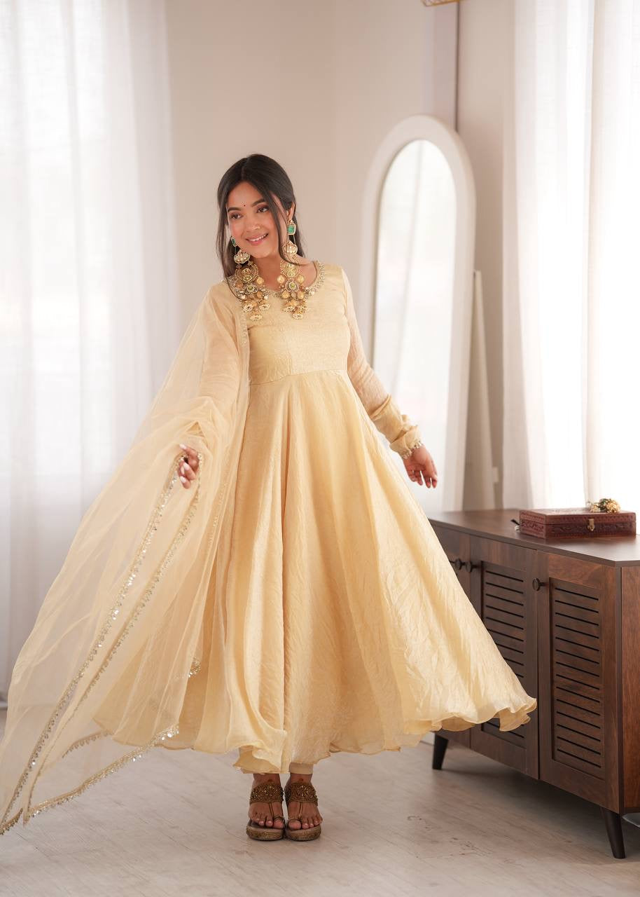 Elegant cream gold anarkali suit set with lace trimmed dupatta