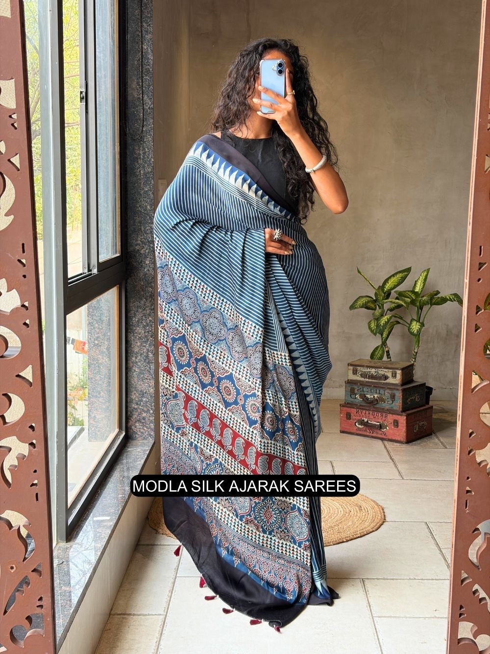 Steel blue modal silk ajrakh printed saree with striped design heritage pallu tassel detailing