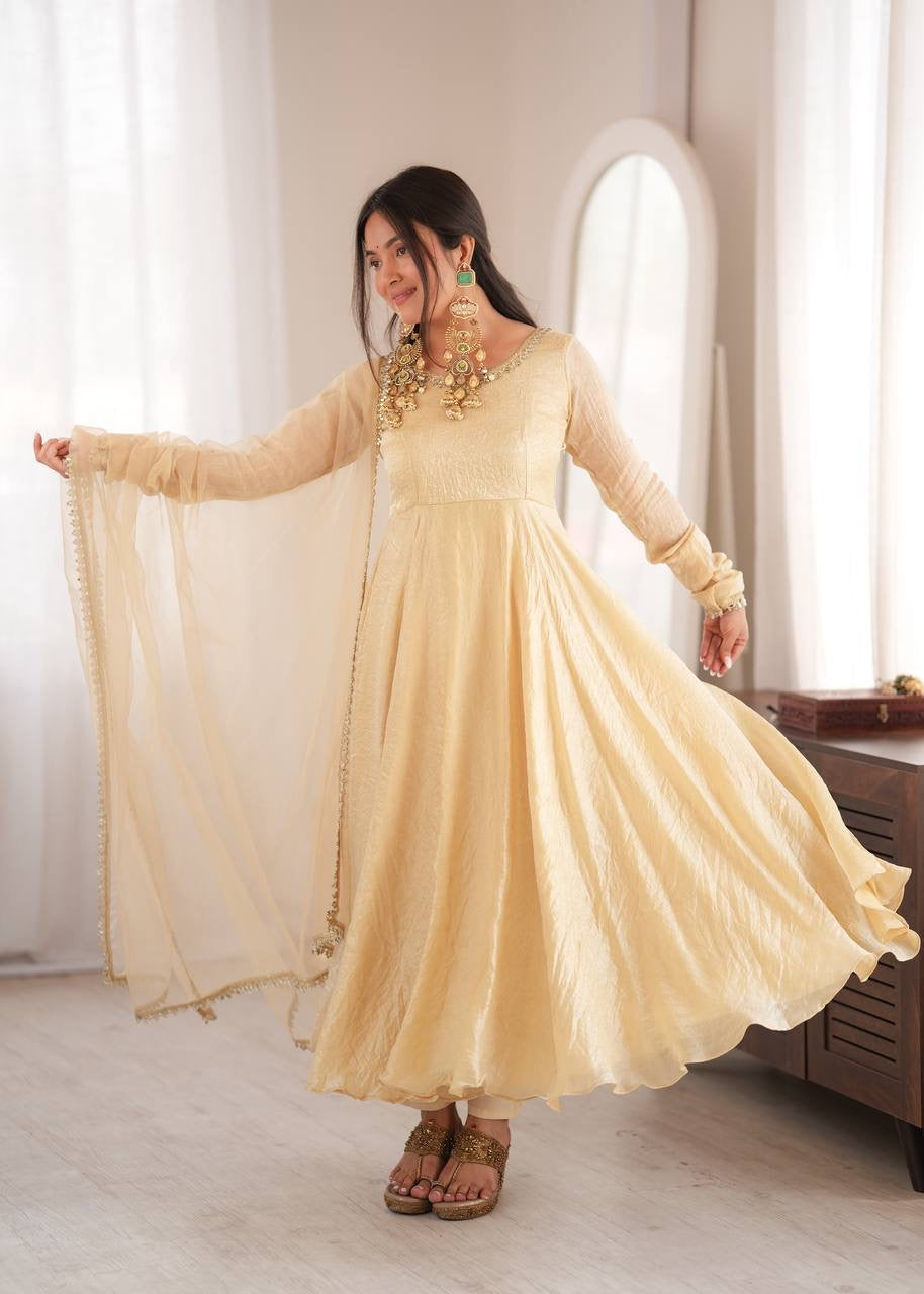 Elegant cream gold anarkali suit set with lace trimmed dupatta