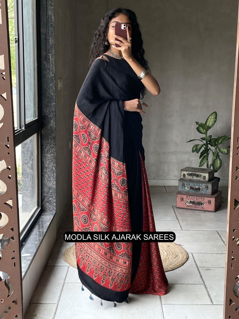 Black red modal silk ajrakh printed saree with heritage border traditional pallu tassel detailing