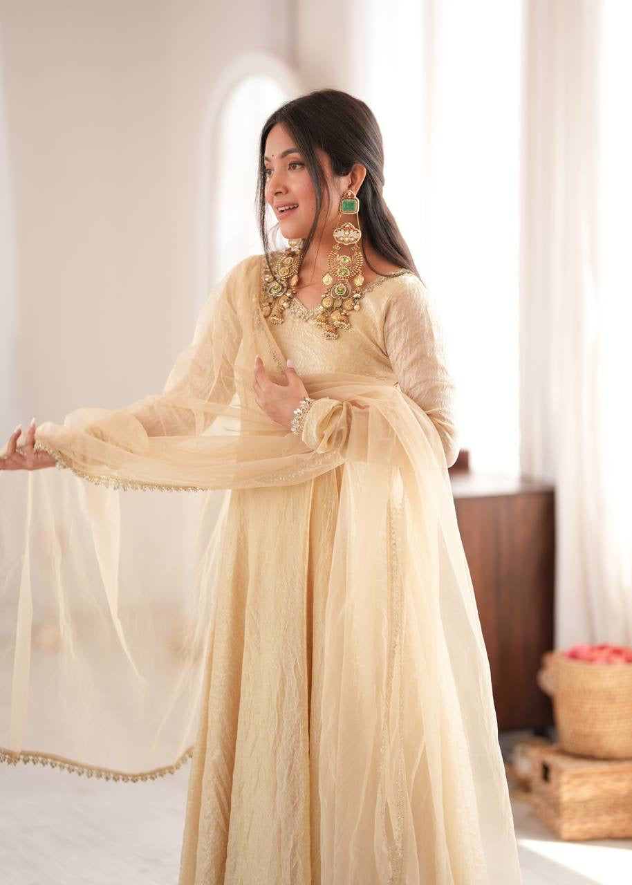 Elegant cream gold anarkali suit set with lace trimmed dupatta