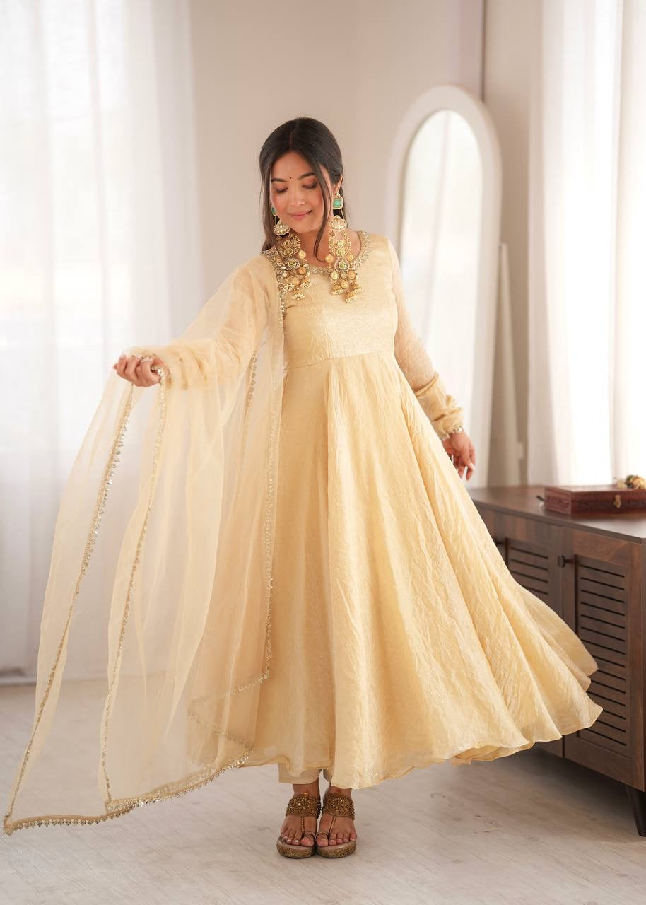 Elegant cream gold anarkali suit set with lace trimmed dupatta