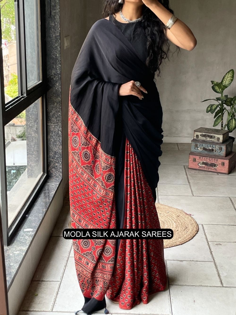 Black red modal silk ajrakh printed saree with heritage border traditional pallu tassel detailing