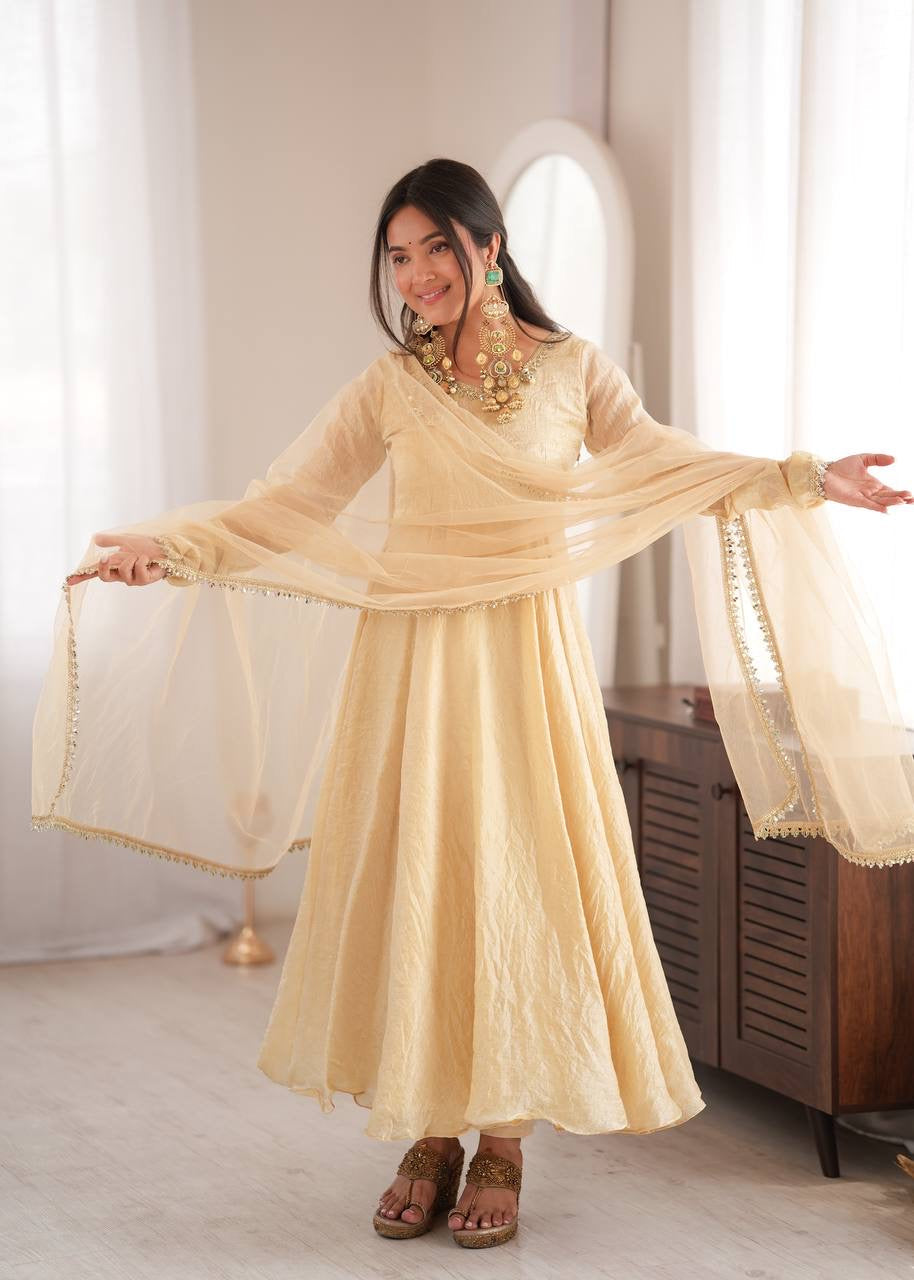 Elegant cream gold anarkali suit set with lace trimmed dupatta