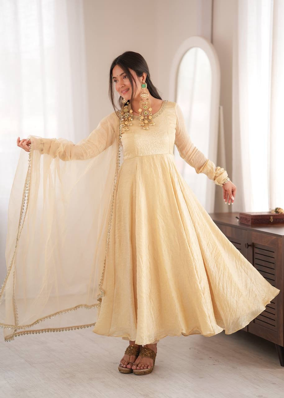 Elegant cream gold anarkali suit set with lace trimmed dupatta