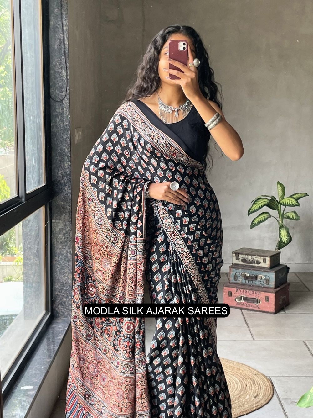 Black modal silk ajrakh printed saree with traditional buta motifs heritage artistic pallu intricate ethnic border