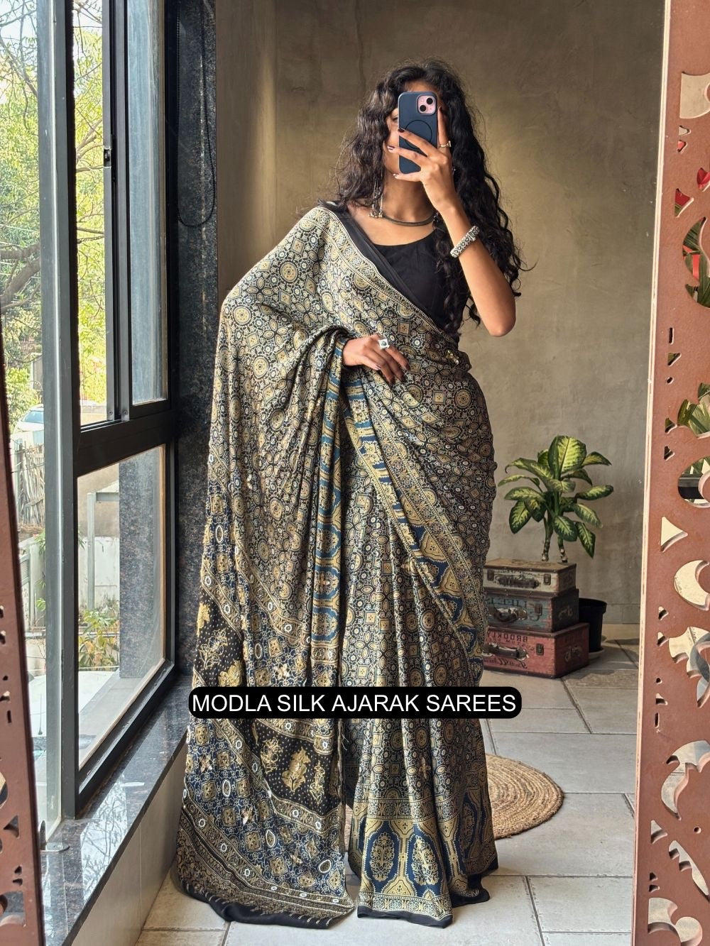 Black modal silk ajrakh printed saree with heritage geometric motifs traditional border artistic ethnic pallu