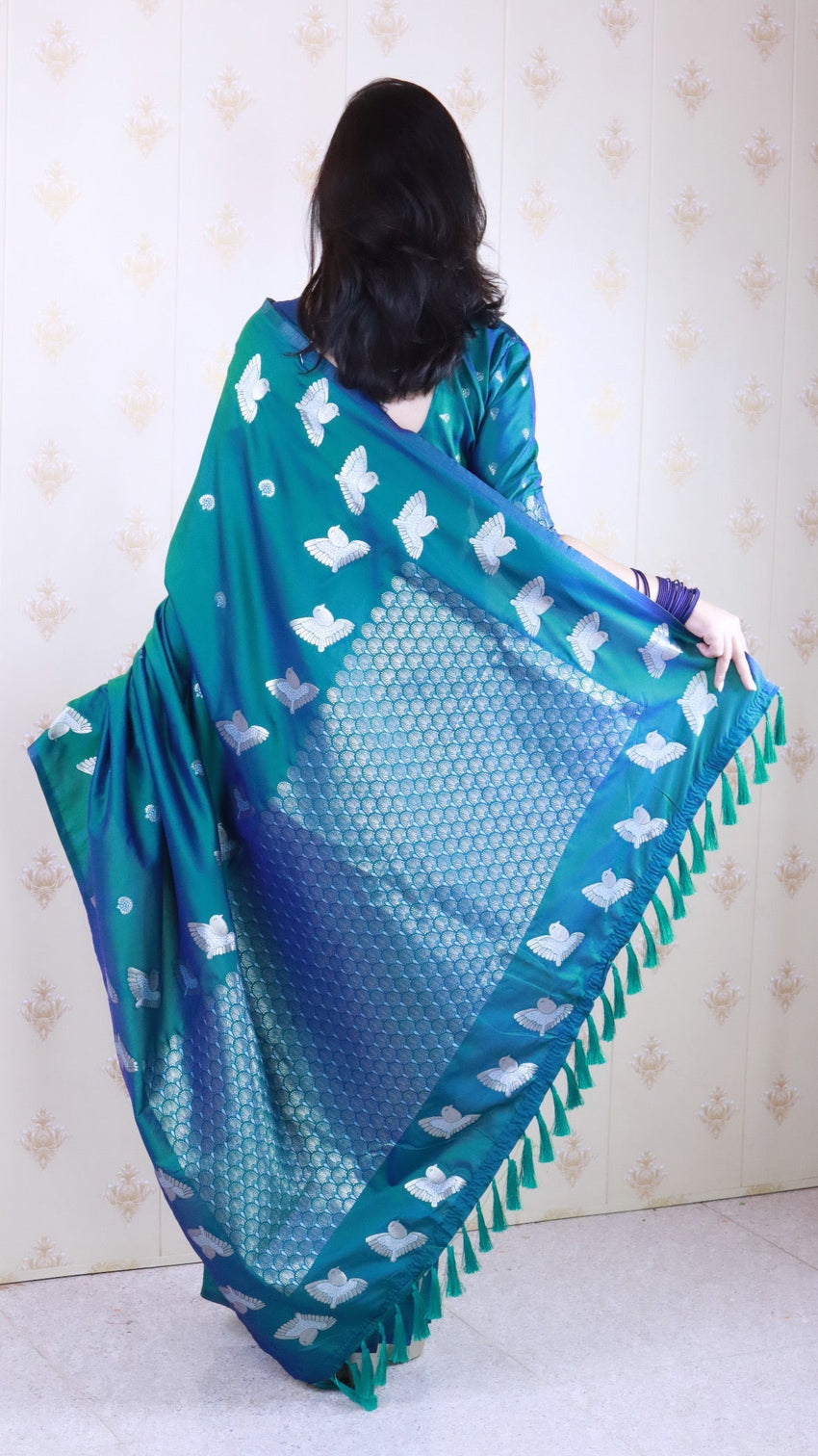 Green soft silk dual zari woven saree with bird border