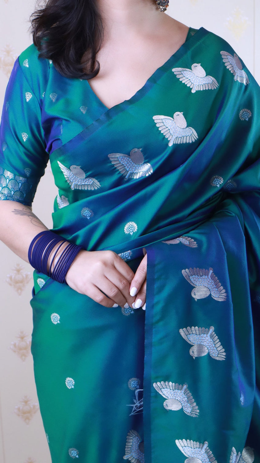 Green soft silk dual zari woven saree with bird border